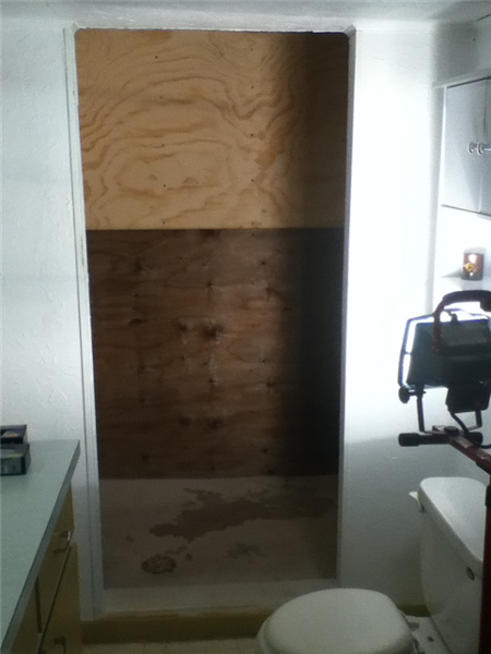 The plywood walls have been installed for a smooth surface for the TPO membrane.