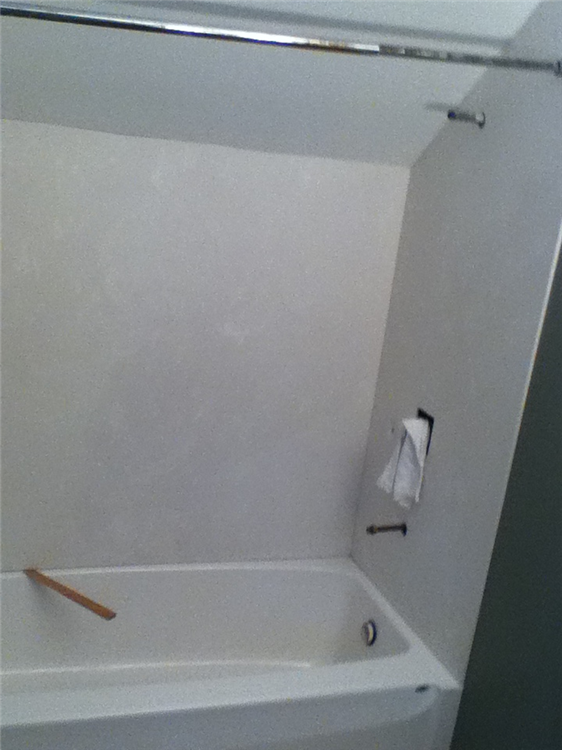 Installation of the marble walls for the shower.