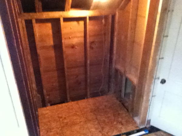 Shower area demolished to bare studs. Bulkhead above old shower removed to the pitch of the dormer to gain more head room for the new shower.