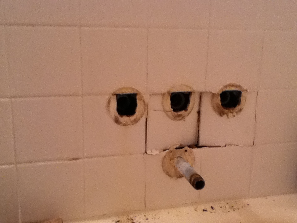 Damage to the ceramic tile walls within the shower. The tile crumbled when the shower valves were removed.