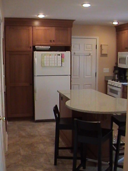 Newly located fridge and kitchen island.