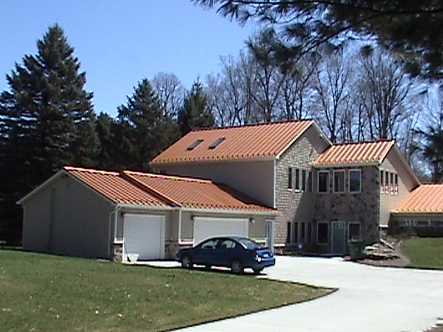 Garage and Front of home view of new metal roofing system.