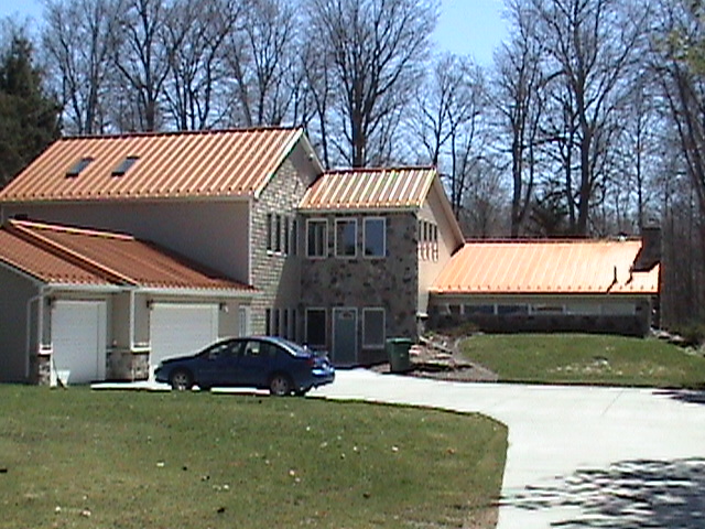 Complete metal roofing system installed to replace shingled roof.